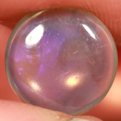 SOLID CRYSTAL OPAL Transparent with a pretty deep purple jumping
